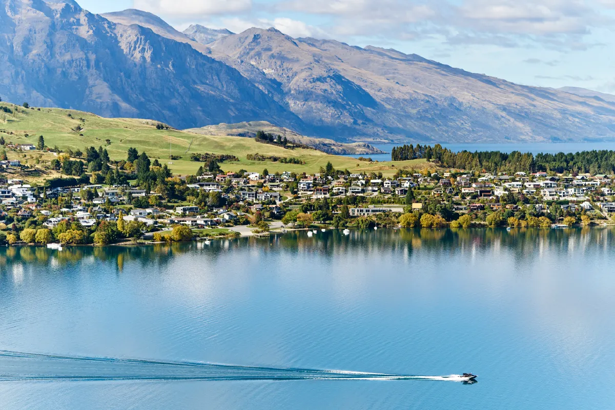 A wide-angle landscape of Queenstown, a world-famous New Zealand wedding photo spot.