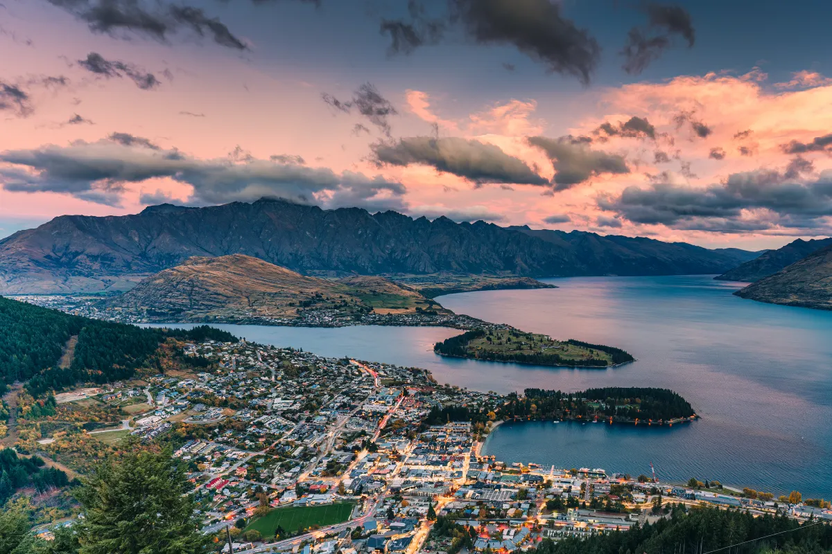 A wide-angle landscape of Queenstown, a world-famous New Zealand wedding photo spot.