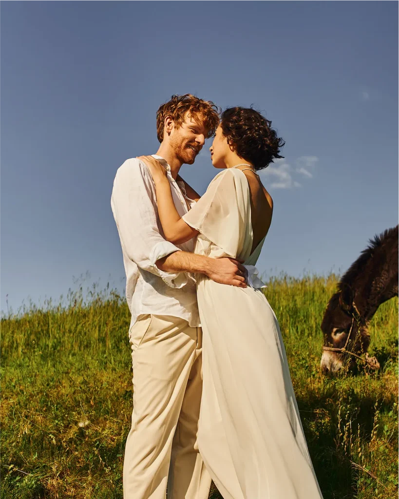 Bride and groom holding hands during a scenic outdoor ceremony, Vowly Wedding Video Production NZ.